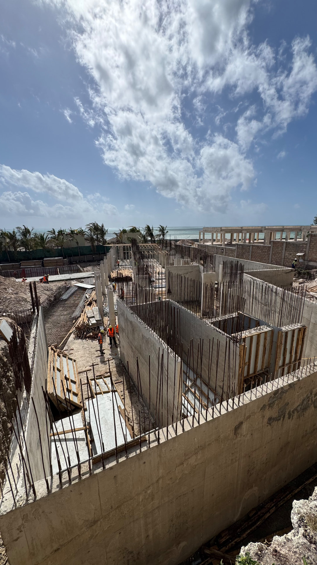 Samawa Beach Resort construction — formwork and rebar preparation along the shoreline